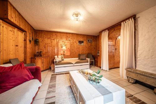 a living room with a couch and a table at Chez les Charles in Bernex