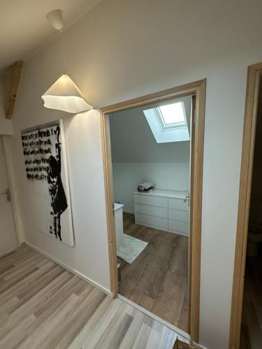 a room with a sliding glass door and a bathroom at Villa julia in Cros
