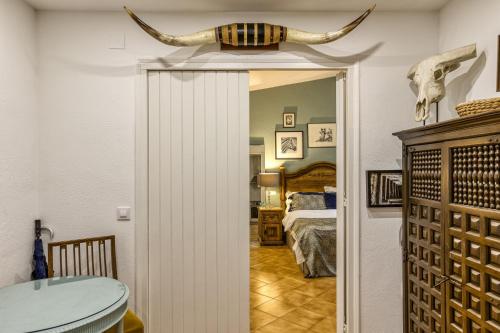 an open door to a bedroom with a bed at Bosque Apartamento in Girona