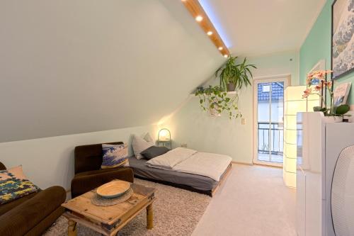 a living room with a couch and a table at The House Stiller Grund in Hohenfließ