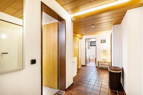 a hallway of a house with wooden ceilings at Ferienwohnung Hennings in Bargenstedt
