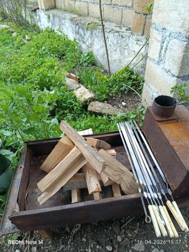 a pile of wood sitting in a box at Qusar Eniğ kend in Qusar