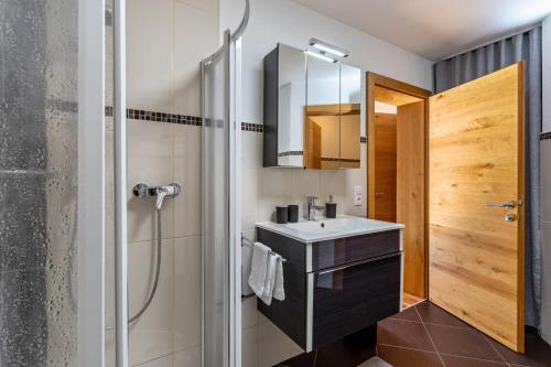 a bathroom with a sink and a shower at Bergschatz in Wildschönau