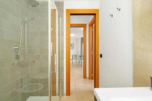a bathroom with a shower and a walk in shower at Villa Marconi Apartment 9 in Golfo Aranci