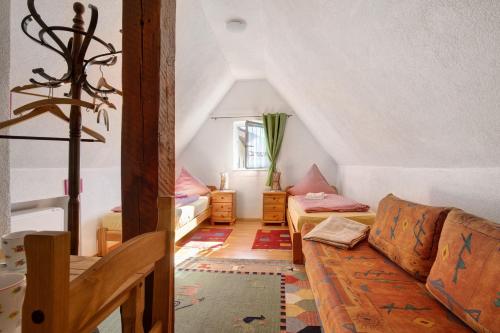 a living room with a couch and a table at Ferienwohnung Sila 3 in Weinstadt