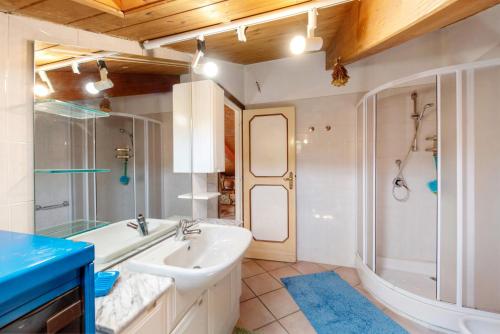a bathroom with a sink and a shower and a tub at La Liguria tra gli Ulivi 2 in Varazze