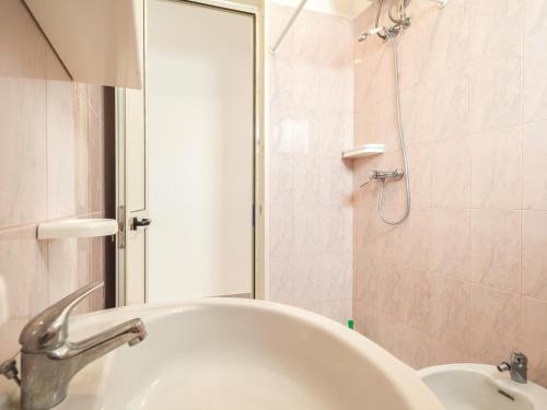 a bathroom with a sink and a shower at Villa Tetta sul mare in Torre Lapillo