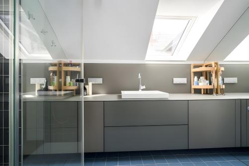 a bathroom with a sink and a skylight at Seezauber in Malchow