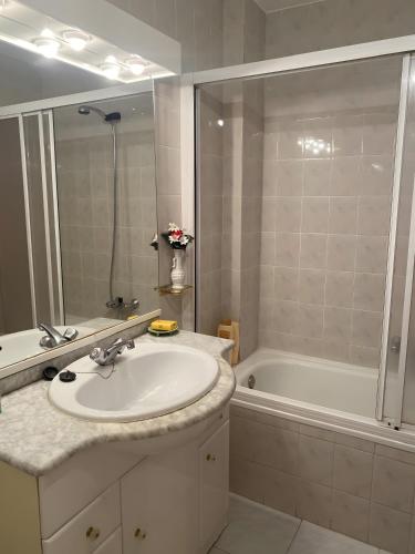 a bathroom with a sink and a bath tub at Montes de Alhama Il in Soria