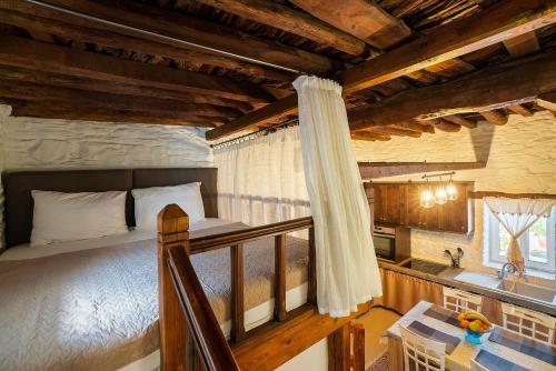 a bedroom with a bed and a sink in a room at Mannas House in Émbonas