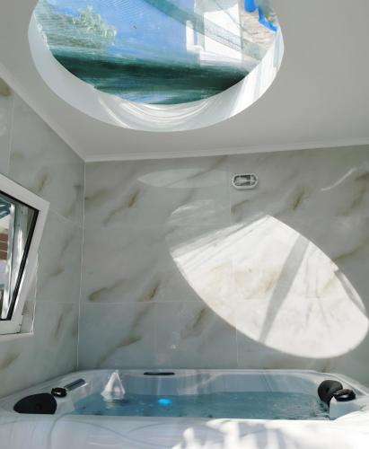 a bathroom with a sink and a mirror at Mannas House in Émbonas