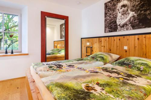 a bedroom with two beds and a mirror at Gästehaus Wüpping 1 in Salem