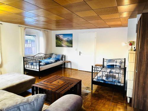 a living room with two bunk beds and a couch at Bauernhofwohnung Friedrichshafen in Friedrichshafen