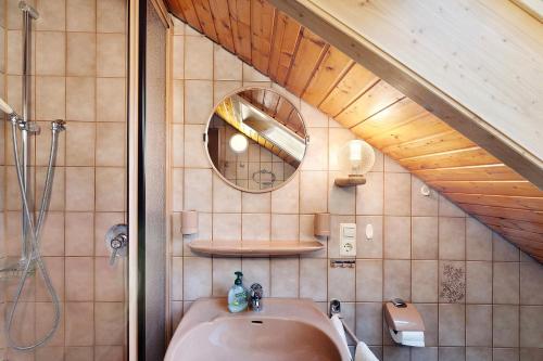 a bathroom with a sink and a mirror at Haus Huber in Wolfach