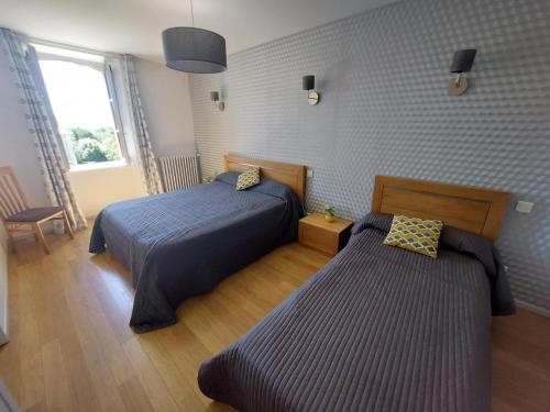 Llit o llits en una habitació de Gite la Chartrouille