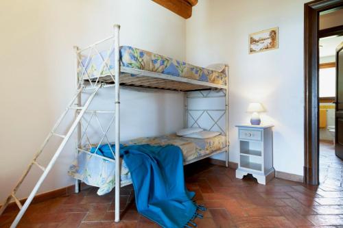 a bedroom with two bunk beds in a room at Apartment Ida Isuledda 2 in San Teodoro