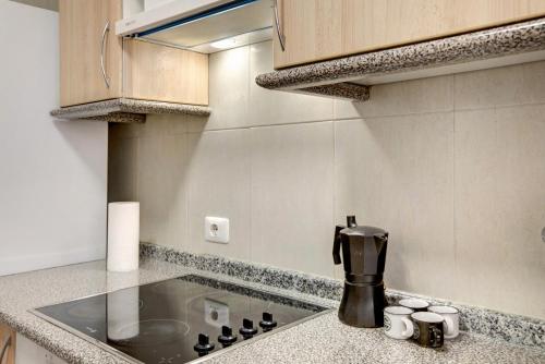 a kitchen with a coffee maker on a counter at Casa Roberto in Candelaria