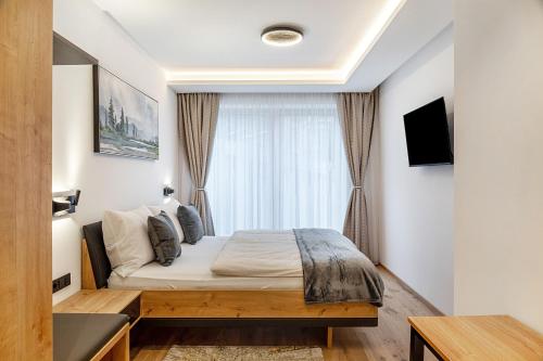 a bedroom with a bed in front of a window at Ferienwohnung Elsa in Fliess