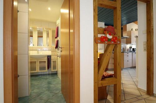 a room with a kitchen with a bunk bed in it at Haus Reichenbach in Glottertal
