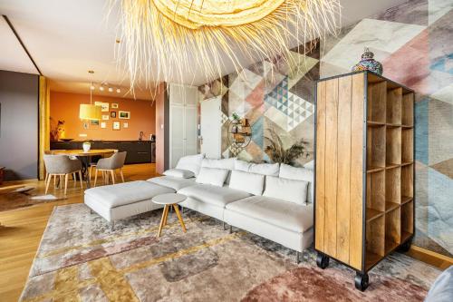 a living room with a couch and a table at Studio am Schloßteich in Chemnitz