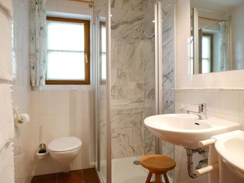 a bathroom with a sink toilet and a shower at Ferienhaus Straubehof in Sasbachwalden
