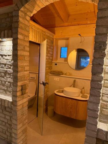 a bathroom with a sink and a toilet at Villa Toscana in Teltow