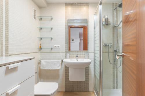 a bathroom with a sink and a toilet and a shower at Don Miguel 2 in Benidorm