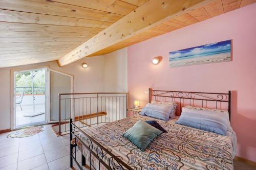 a bedroom with a bed in a room at Casa Taggiasca in Diano Marina