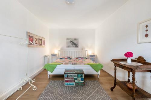 a bedroom with a bed in the corner of a room at Ferienwohnung zur Ostsee in Westerholz