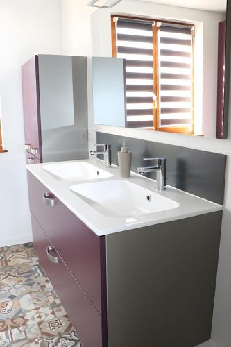 a bathroom with a white sink and a mirror at Gîte La Maison De Caroline, Spa in Sigolsheim