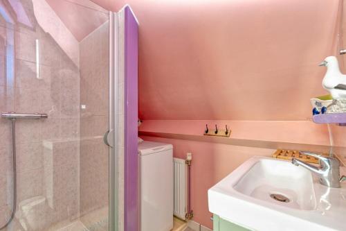 a bathroom with a shower and a toilet and a sink at Le pré Nantais proche plage in Le Croisic