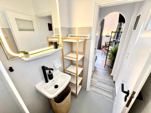 a bathroom with a sink and a mirror at aeolian blu 9 in Parikia