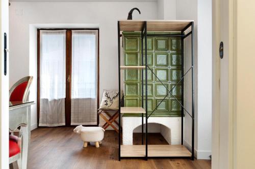 a room with a glass cabinet and a table at Bnb and Breakfast Pellizzano in Pellizzano