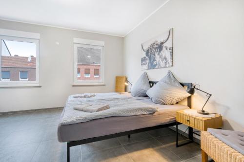 a bedroom with a bed and a window at Stadtquartier Ahaus in Ahaus