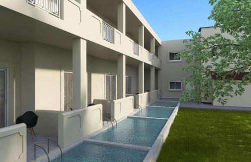 an external view of a building with a swimming pool at Akron Seascape Resort by Anayia All Inclusive Resorts in Sidari