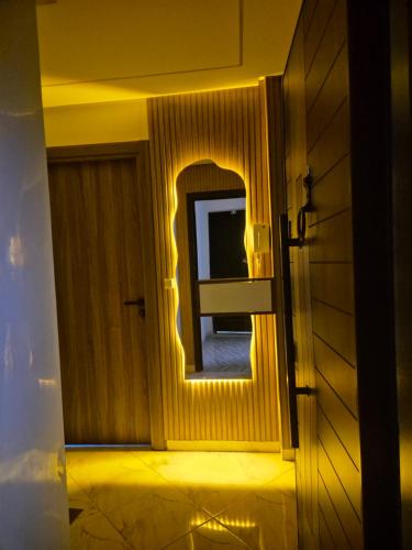 a room with a door with a window with a light at Appartement rif roayal in Al Hoceïma