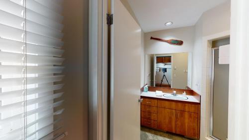 a bathroom with a sink and a mirror at 74 Meadow House in Sunriver