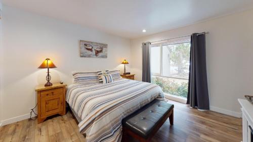 a bedroom with a bed and a window at 79 Meadow House in Sunriver
