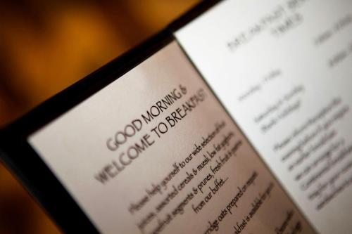 a close up of a book with a cell phone at York House Hotel in Whitley Bay