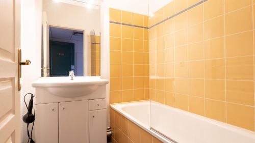 a bathroom with a sink and a bath tub at Virginia N108 - 2P4 in Grasse