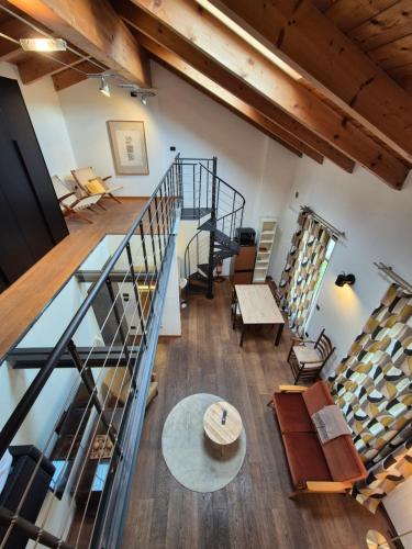 an overhead view of a loft with stairs and a table at Urban Loft Duomo in Alba