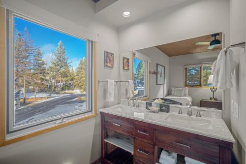 a bathroom with a sink and a large window at 76 Meadow House in Sunriver