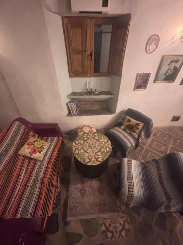 a living room with a couch and a table at Casa Buena Vista in Ugíjar