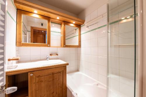 a bathroom with a sink and a shower at Lapon H10 in Hauteluce