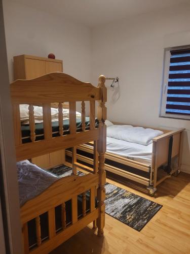 a bedroom with two bunk beds in a room at Ferienhaus Schw Agnes in Warin