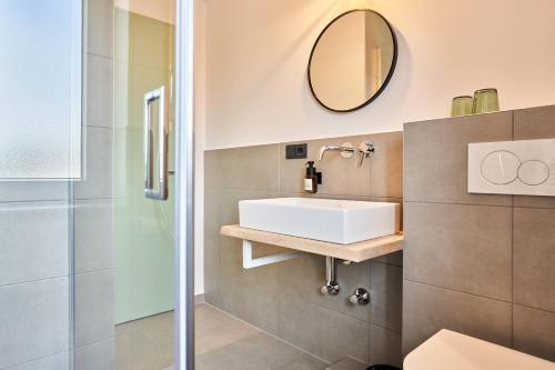 a bathroom with a sink and a shower at Alte Seifensiederei - Jane in Bad Tölz