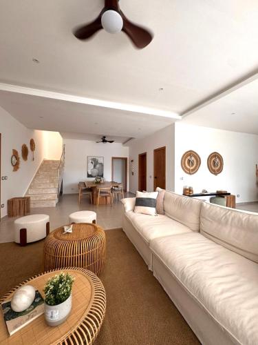 a living room with a couch and a table at Sol de Arena Beachfront, Las Terrenas in Las Terrenas