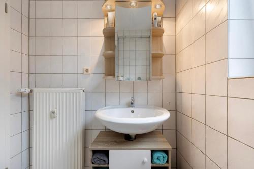 a bathroom with a sink and a mirror at Veith in Hildesheim