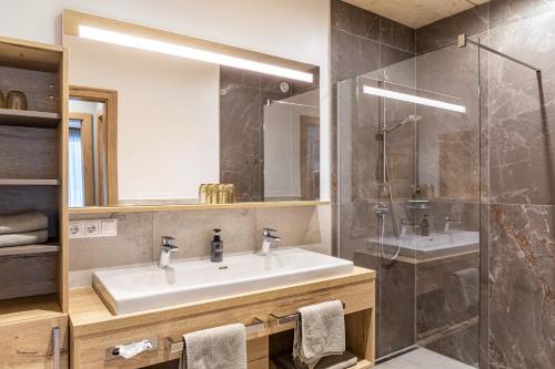 a bathroom with a sink and a shower at Apartment Steinbock in Pflach
