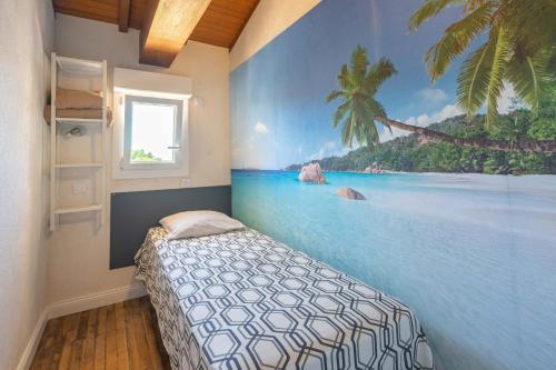 a bedroom with a mural of a beach at Villa Cap mer 17 in Saint-Palais-sur-Mer